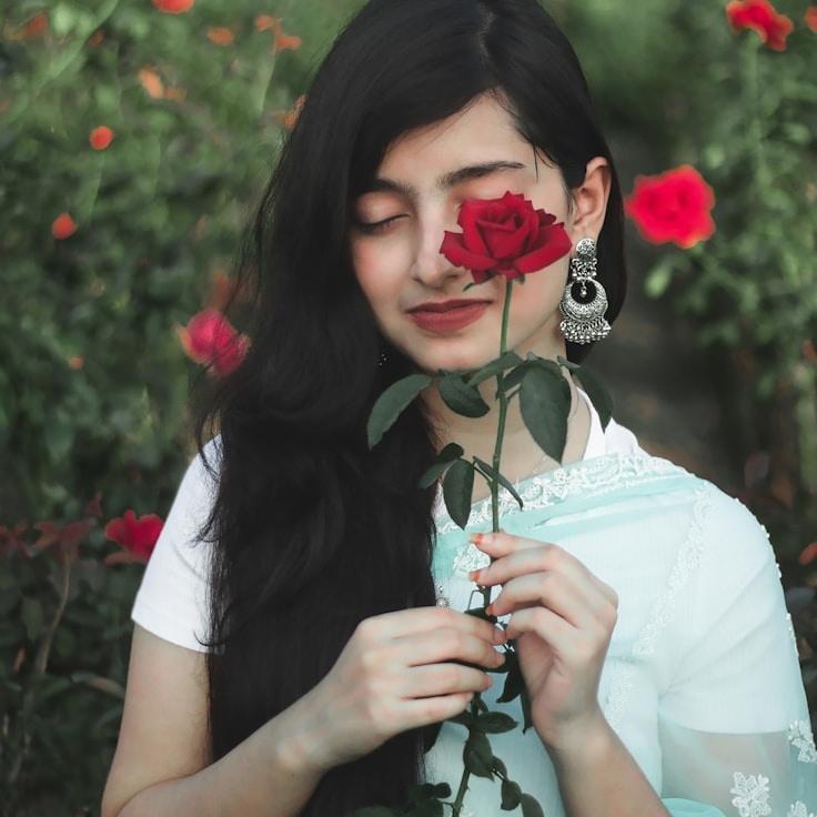 Alex Rivera, Lead Design Curator at Smooth Cloud Build, reviewing corporate floral arrangements